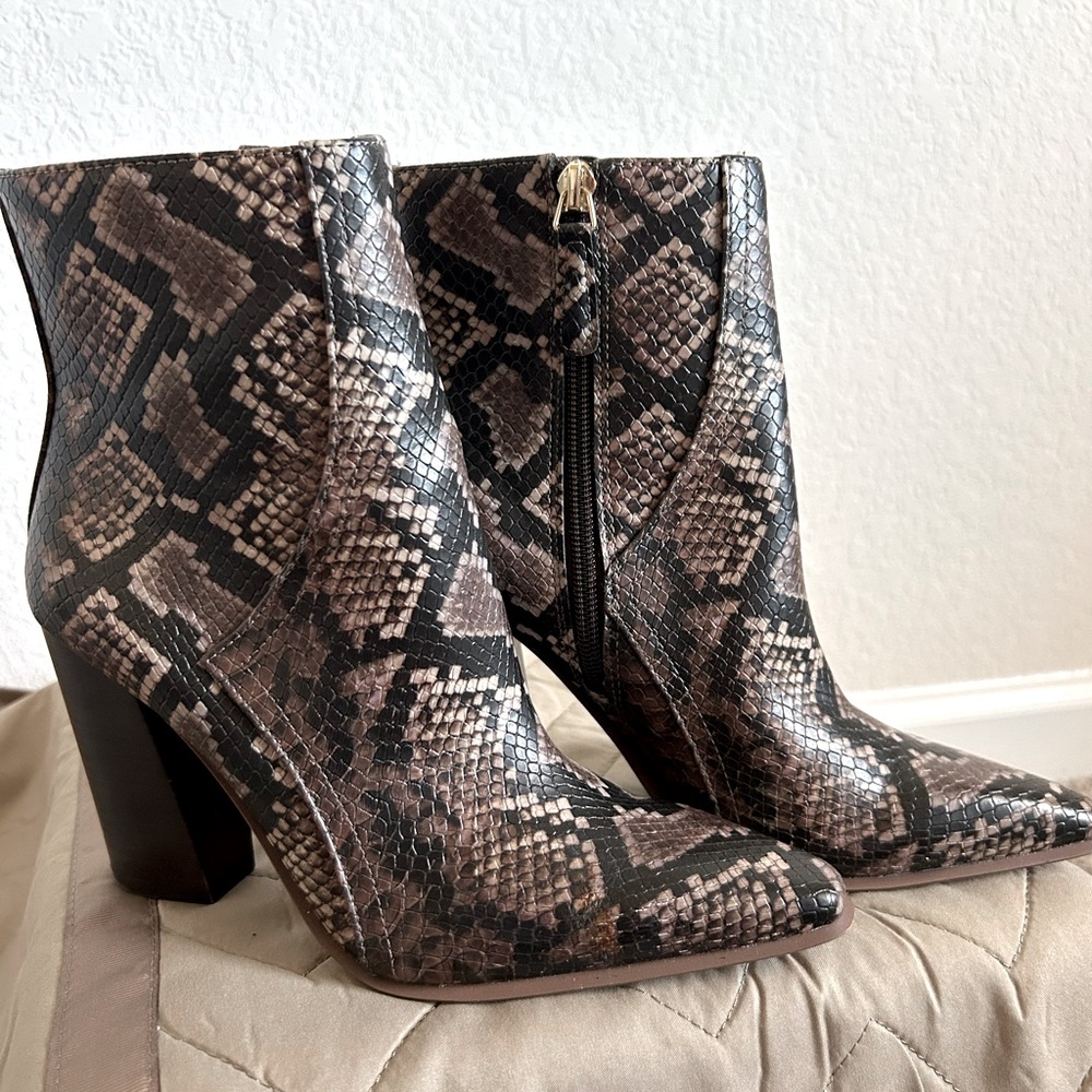 Slightly worn faux snake skin boots